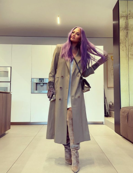 Chrissy Teigen showing off her new purple wig.